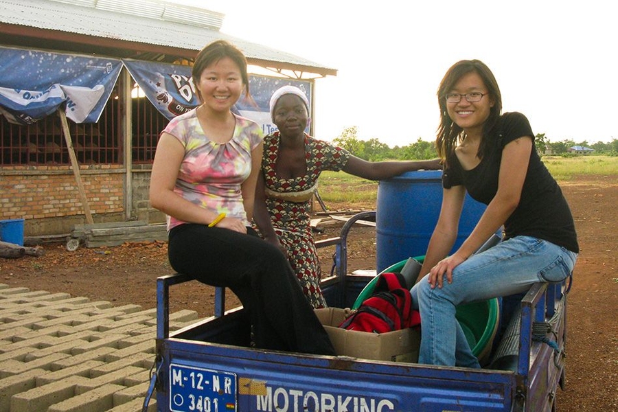 Xing and Oh shop for local materials with one of their local partners, Zainab.