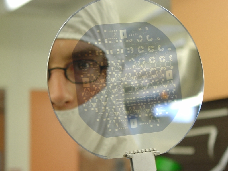 Researcher looks at reflection of chrome plated device