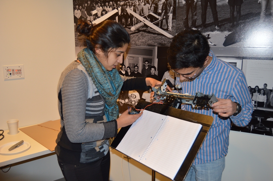 MIT students hacked a printer to create the mechanical page turner. By moving his head, their client, a conductor with cerebral palsy, can command the device to turn pages of sheet music. 