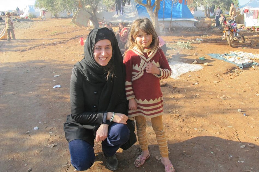 Christia visits Syrian internally-displaced children in a camp in December 2012.