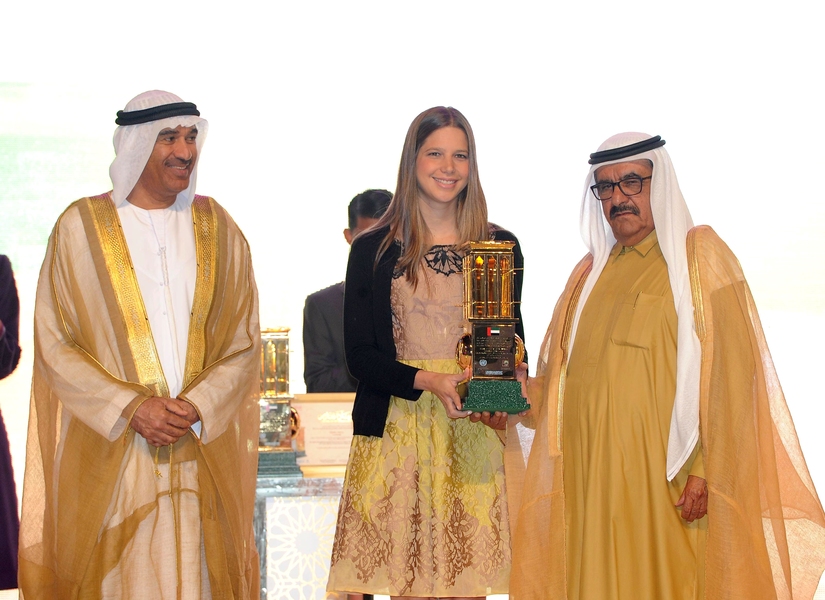Ana Vargas (center) receives the Dubai International Award for Best Practices from Sheikh Hamdan bin Rashid Al Maktoum (right), deputy ruler of Dubai.