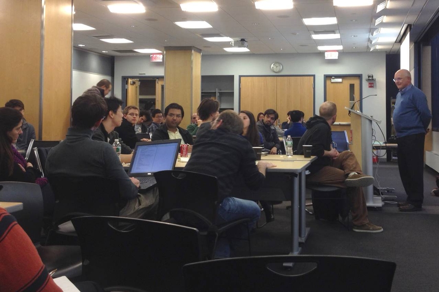 MIT Professor Charles Leiserson speaks at a Postdoc6 workshop about crafting a brief research statement to be delivered like a pitch.