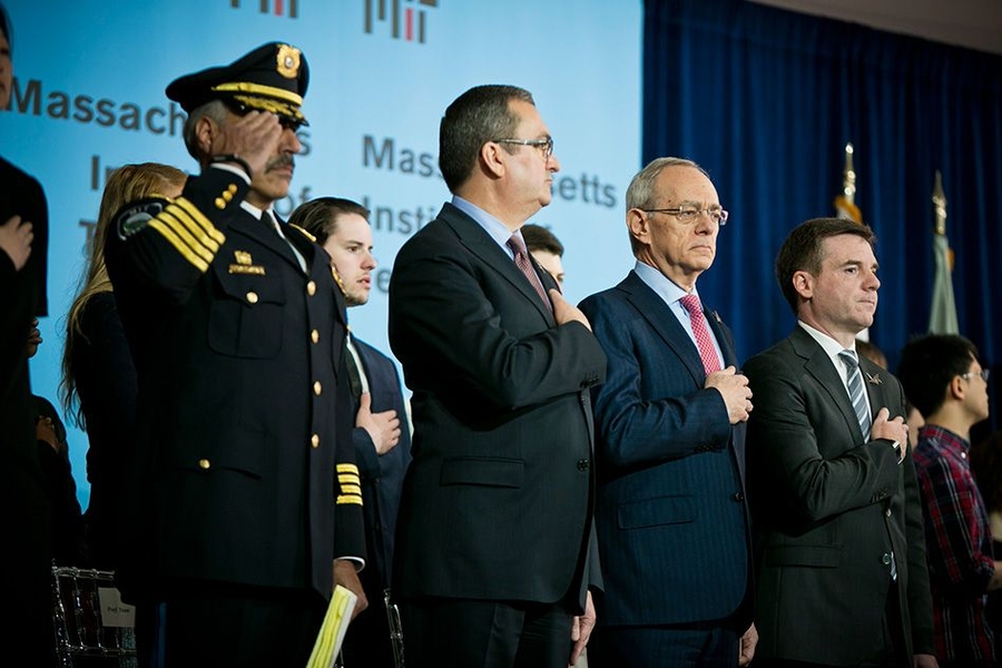During the Pledge of Allegiance at today's dedication of the Collier Memorial: (from left) John DiFava, MIT's director of campus services and chief of police; Cambridge Mayor David Maher; MIT President L. Rafael Reif; and MIT Executive Vice President and Treasurer Israel Ruiz.