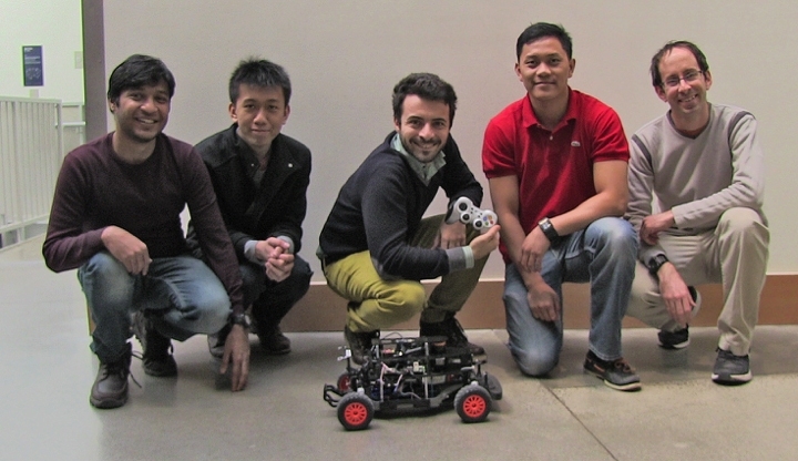Left to right: Students Abhishek Agharwal, Jason Ma, Valerio Varricchio, John Alora, and postdoc Guy Rosman pose with their robot vehicle.