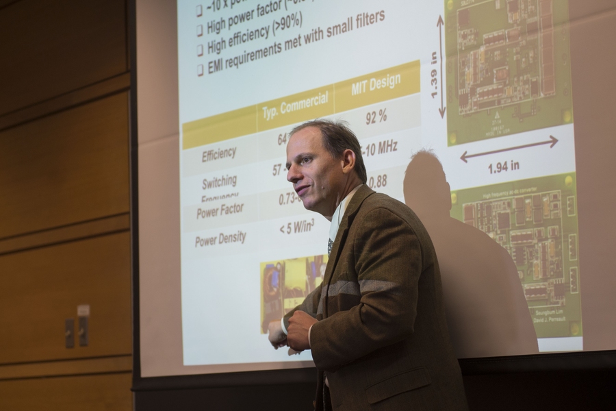 Professor David Perreault, EECS associate department head, describes his research and helped organizers to make the MIT IEEE/ACM Voltage Research Expo possible.