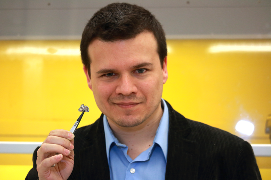 Pablo Jarillo-Herrero, the Mitsui Career Development Associate Professor of Physics, holds a chip of graphite, the raw material for extracting one-atom-thick graphene. His lab studies the unusual electronic and optical properties of graphene.