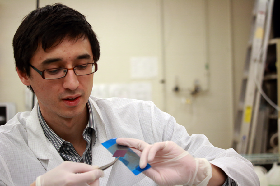 Postdoc Javier Sanchez-Yamagishi peels off, or exfoliates, thin layers of graphene from graphite using special tape and a silicon slab in Associate Professor Pablo Jarillo-Herrero’s lab.