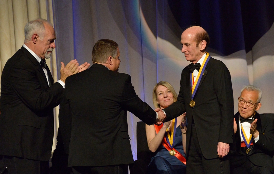 Standing: Donald Morel (left), chair of the Franklin Institute Board of Trustees, looks on as Larry Dubinski, president and CEO of the Franklin Institute, shakes Stephen Lippard's hand. Seated (left to right): Cornelia Bargmann of Rockefeller University won the Benjamin Franklin Medal in Life Science, while Syukuro Manabe of Princeton University won the Benjamin Franklin Medal in Earth and Environ...