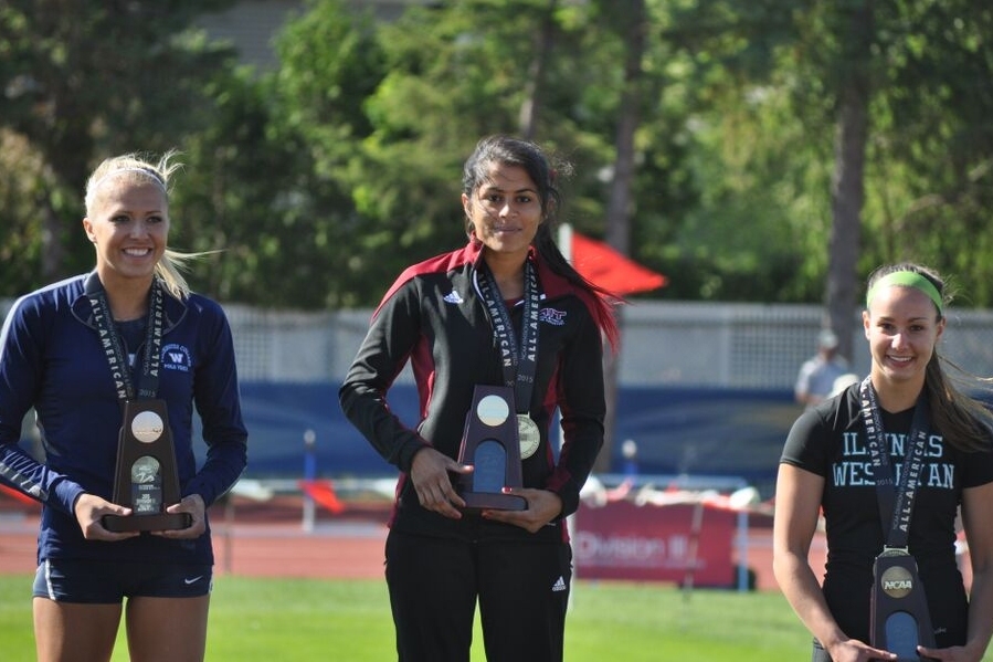 Junior Cimran Virdi takes the podium for her national crown in pole vault.