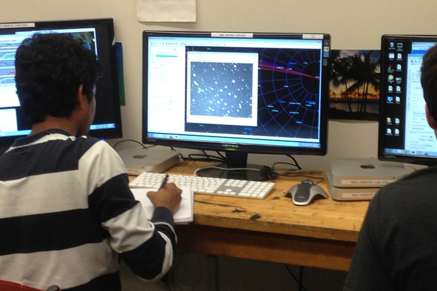 Students in Building 54 remotely observe the night sky using a telescope at the Wallace Observatory.