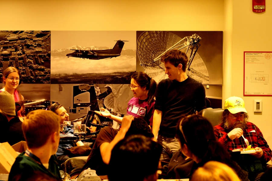 (L-r): Kate Tatar, Adrian Mallozzi, Esther Jang, and Ned Burnell give the final presentation at the Feb. 28 ATHack as Adriana Mallozzi demonstrates their working prototype by taking a selfie.