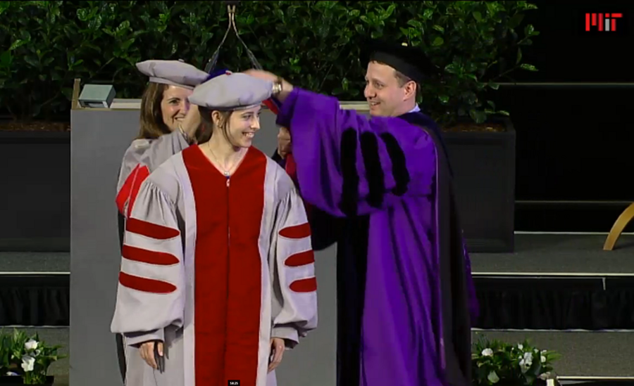 Rachel Zucker receives her MIT doctoral hood on June 4 from Chancellor Cynthia Barnhart and Department of Materials Science and Engineering head Christopher Schuh. Zucker's thesis work modeled thin-film dewetting.