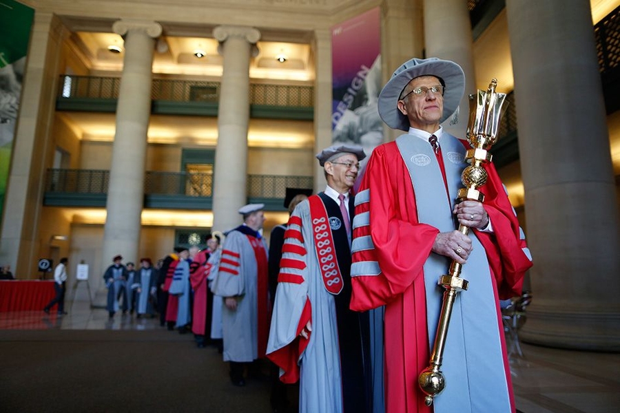 The academic procession was led by Donald Shobrys, president of the MIT Alumni Association and a member of the MIT Corporation, who is carrying the Institute's ceremonial, beaver-topped mace. He was followed by MIT President L. Rafael Reif and Robert Millard, chair of the MIT Corporation.
