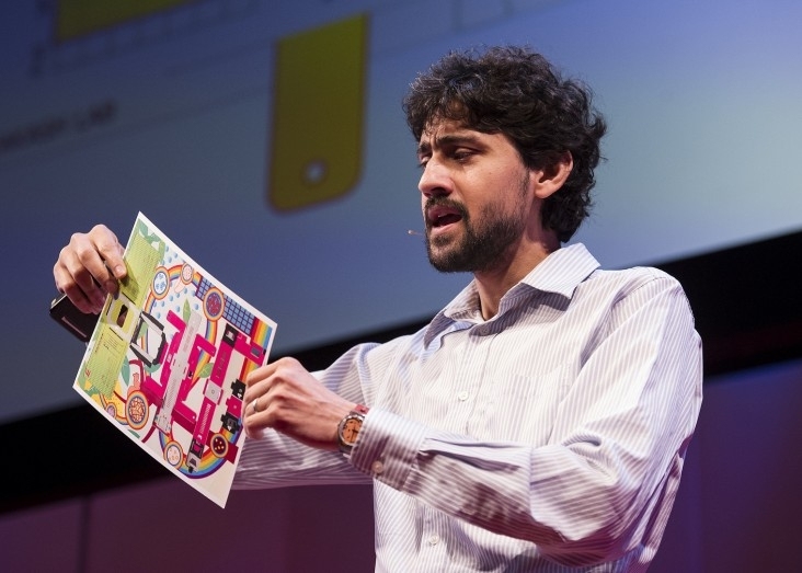 Manu Prakash SM ’05, PhD ’08 demonstrates his Foldscope, a microscope made of paper.