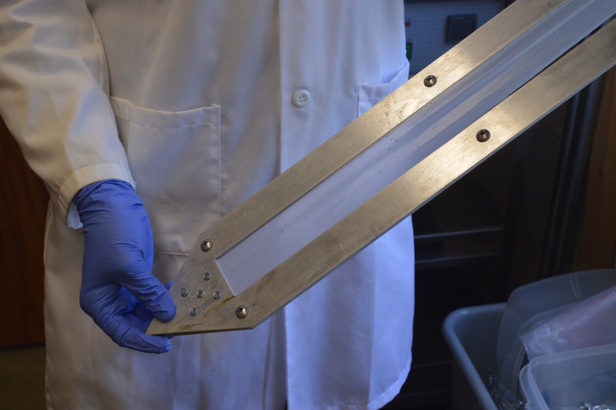 Prendergast prepares a passive sampler for analysis after deployment in the Duwamish River sediment.