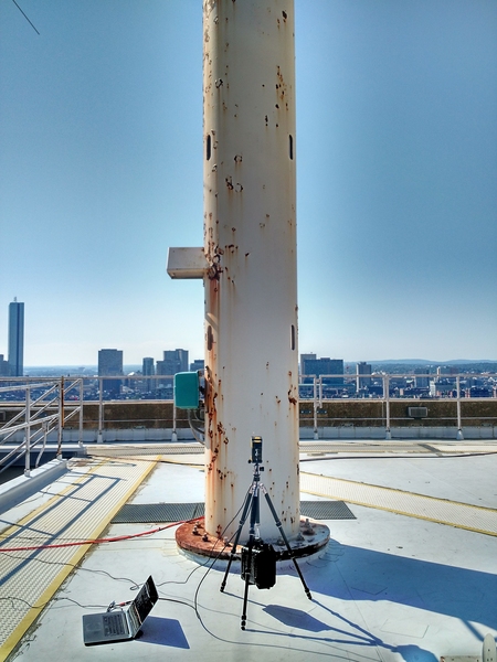 An experimental setup measured the vibrations of a crow's nest using a laser vibrometer on the roof of MIT's Green Building.