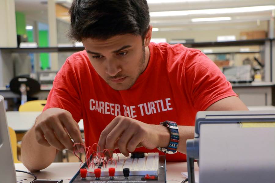 Summer Scholar Jonah Sengupta wires a prototype amplifier circuit for a project to use novel annealing methods for aligning block co-polymer films and reduce their annealing time. Because the methods being applied in the lab of MIT Professor Karl Berggren haven’t been used before, “It would be nice ... if this project turned out nicely,” Sengupta says. Preliminary results exhibited small- to...