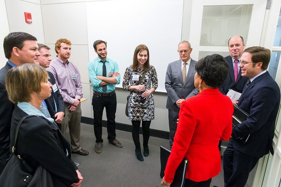 Pritzker meets with Professor Dina Katabi (center) and graduate students Zachary Kabelac (purple shirt) and Fadel Adib (green shirt), along with other officials, ahead of her remarks. Katabi, Kabelac, and Adib participated in the White House’s first annual "Demo Day" to promote innovation and entrepreneurship, presenting a wireless motion-tracking device they invented.