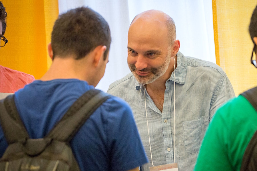 Professor Agustín Rayo discusses philosophy classes with students at the TOUR de SHASS.