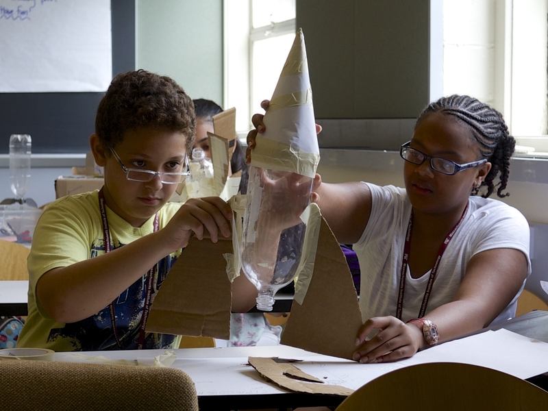 Mehdi Kayi and Aliesha Campbell, both of Boston, design bottle rockets after learning about propulsion and thrust during their aeronautics and astronautics unit.
