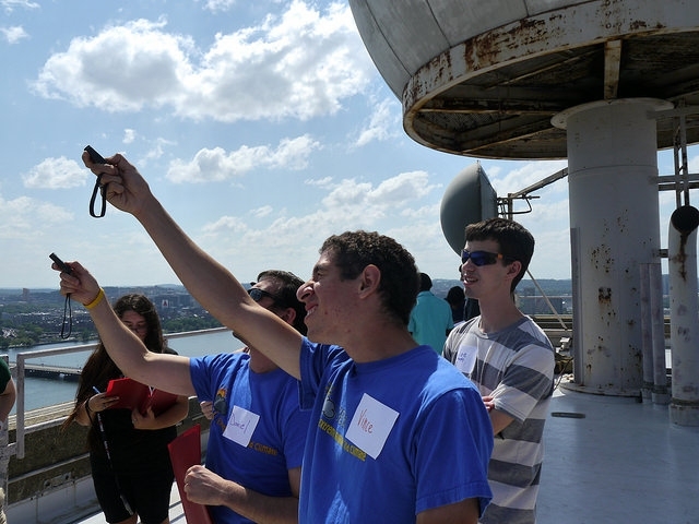 Students take atmospheric measurements on the roof of the Green Building.