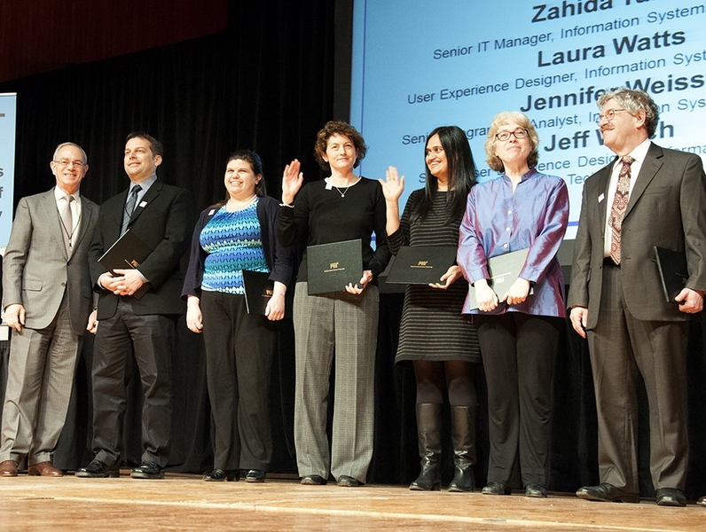 President L. Rafael Reif congratulates the Forms and Petitions Team at the 2015 MIT Excellence Awards and Collier Medal ceremony.