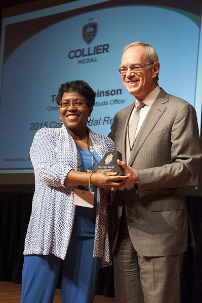 The 2015 recipient of the Collier Medal, Toni Robinson, is congratulated by President Reif at the 2015 ceremony.