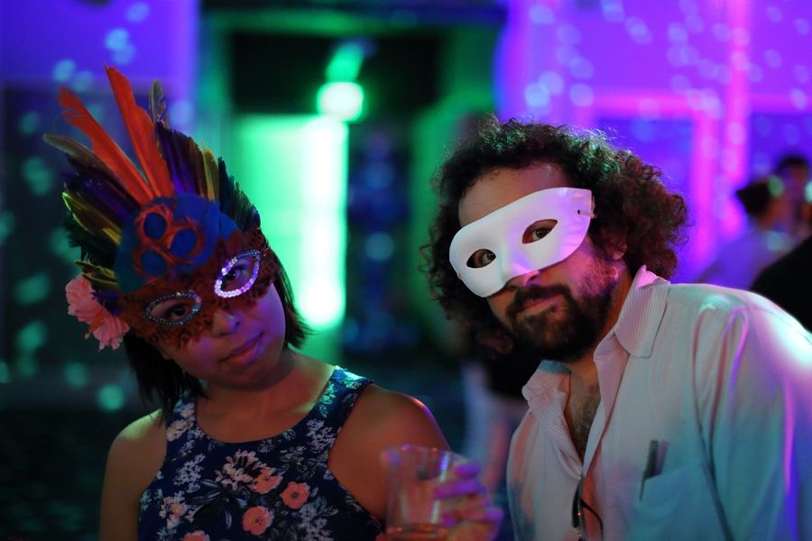 Graduate student Lily Bui and Joe Diaz ’11 show off their masks at the dance party. 