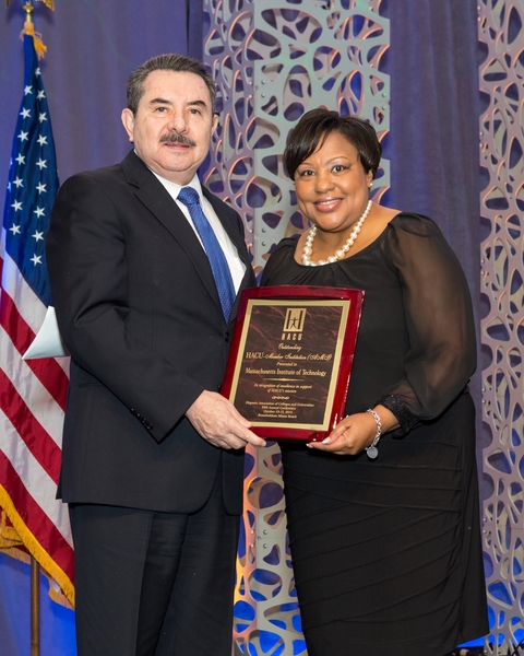 HACU President and CEO Antonio Flores presents MIT's award to DiOnetta Jones Crayton, associate dean and director of the Office of Minority Education.