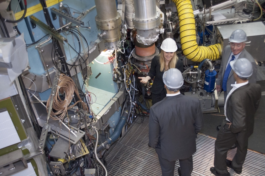 U.S. Senator Cory Booker and Union of Concerned Scientists President Ken Kimmel tour MIT’s tokamak, Alcator C-Mod, with Professor Anne White and PSFC Director Dennis Whyte.