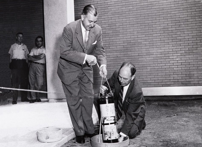 A 1957 photograph shows President James R. Killian Jr. (left) and professor of electrical engineering Harold “Doc” Edgerton burying the time capsule.