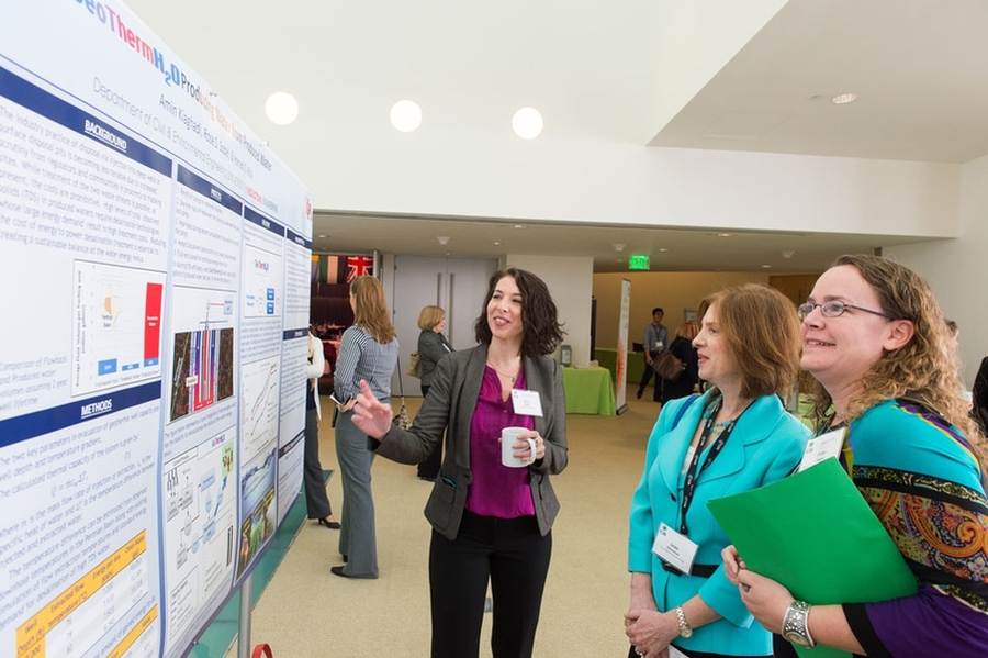 Graduate student poster session first-place winner Rose Sobel of the University of Houston describes her research to Linda Silverman of the U.S. Department of Energy and C3E awardee DaNel Hogan, director of The STEMAZing Project in the Office of the Pima County Superintendent.