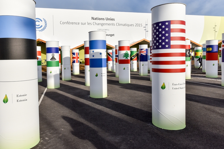 Outside Le Bourget, the COP21 venue in Paris, nations’ flags wrap around columns representing their participation. Members of the MIT community are participating as observers to the climate talks, and holding events to share their climate and energy research.