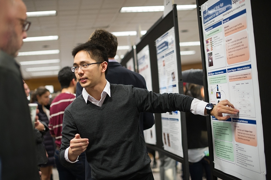 SuperUROP students presented posters on research projects they have been working on since September. Here, senior Shau-Chieh Hsu presents his SuperUROP project.