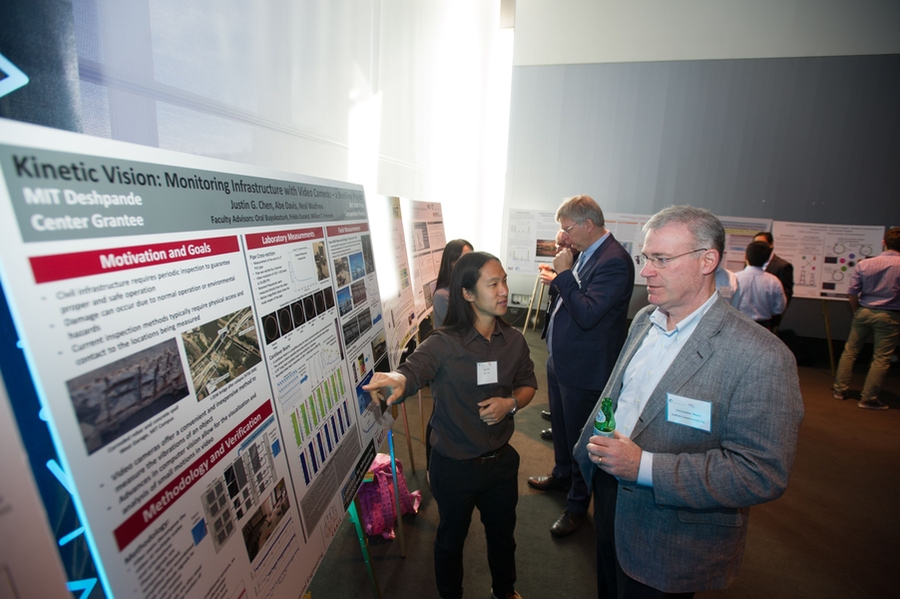 CEE graduate student Justin Chen describes his research at the poster viewing session.