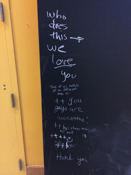 Students write their thanks next to the chalk art.