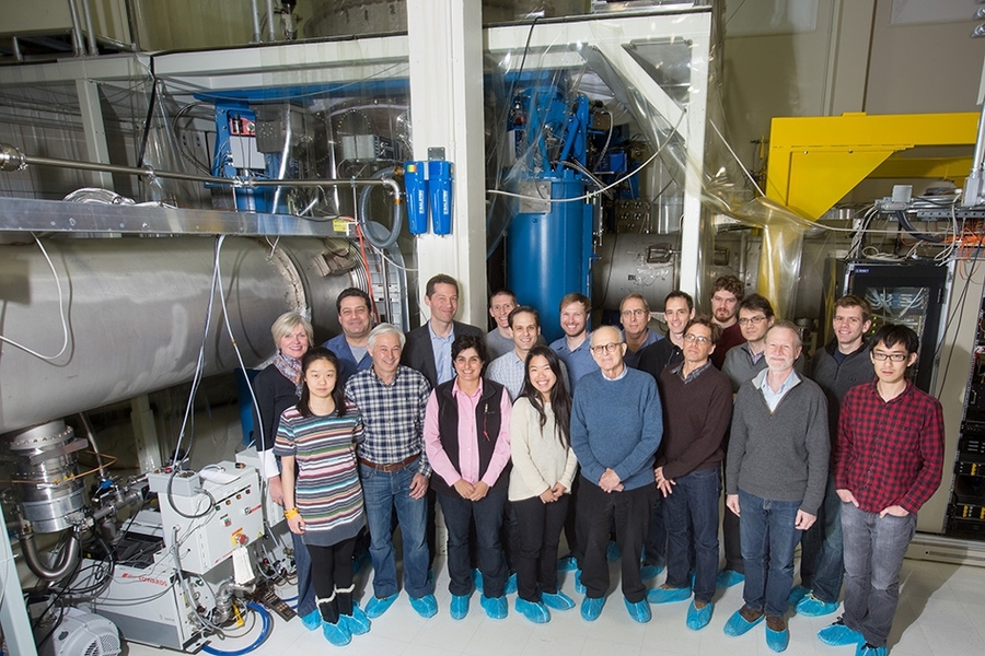 Many of the members of the LIGO Group at MIT, including students, postdocs, engineers, staff, and faculty, gather in front of the full-scale LASTI testbed.