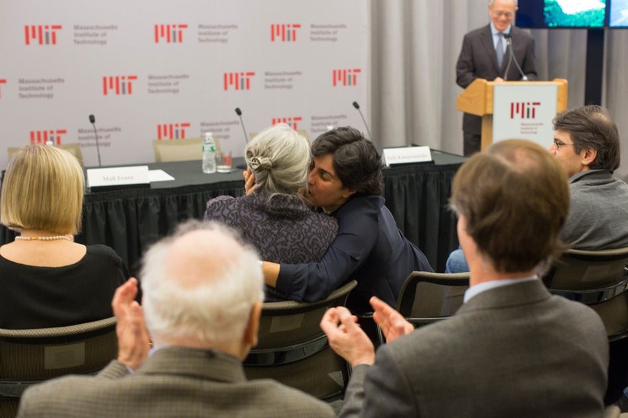 LIGO scientist and MIT professor Nergis Mavalvala hugs Rebecca Weiss at the MIT event.