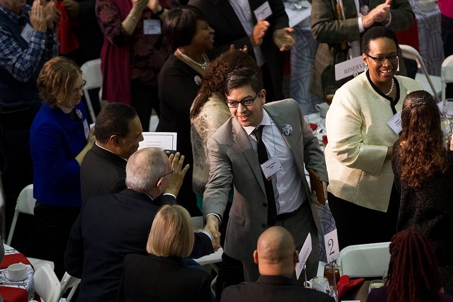 Sergio Cantu shakes hands with President Reif. “We need to help empower others,” Cantu said during his speech.
