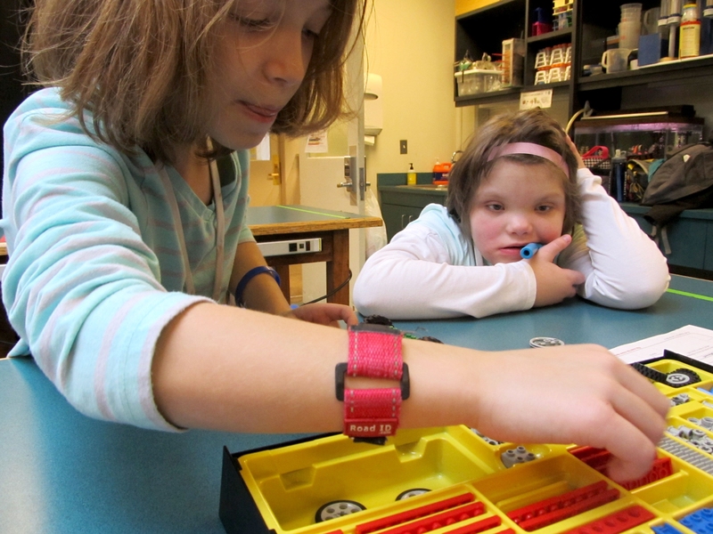 Students build their Lego car using one of the Edgerton Center’s kits.