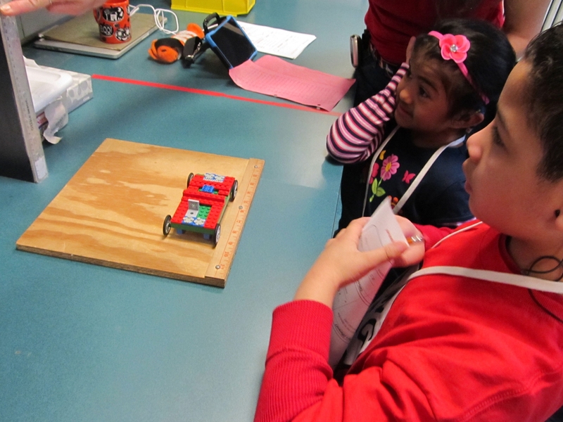 Students put their Lego car to the first test: the tiltboard test.