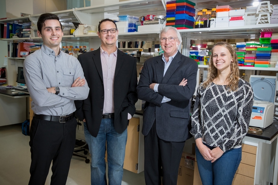 (Left to right) Miles Miller, Frank Gertler, Douglas Lauffenburger, and Madeleine Oudin in the Gertler Lab at MIT.