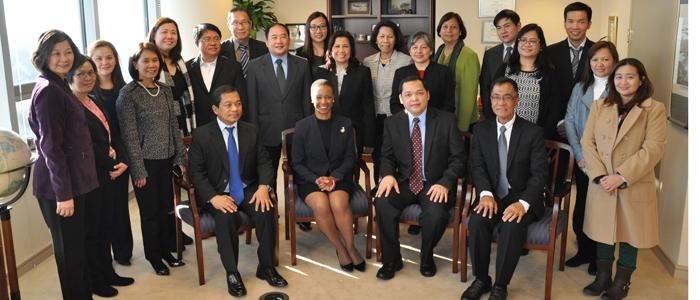 Deputy Director Enoh T. Ebong welcomes a delegation of high-level Philippine Government officials at USTDA's headquarters.