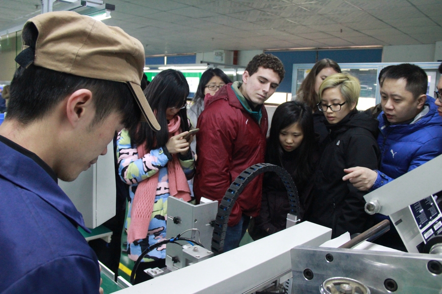 MIT students on a tour of Derneng, a factory located in the Guangdong province in China. 
