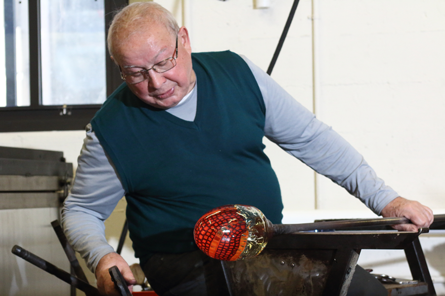 Close look: Lino Tagliapietra gives a close look as he works on an early stage of a large vessel with an intricate pattern.