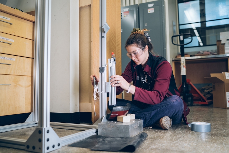Making at MIT happens inside and outside of courses such as in 3.042 (Materials Project Laboratory). Here, senior Frances Lenahan is using a drop tower she and her team built to measure the impact-absorbing properties of materials like those in a bicycle helmet (seen here) and to test original materials inspired by the stunning impact resistance of a ram’s horns.
