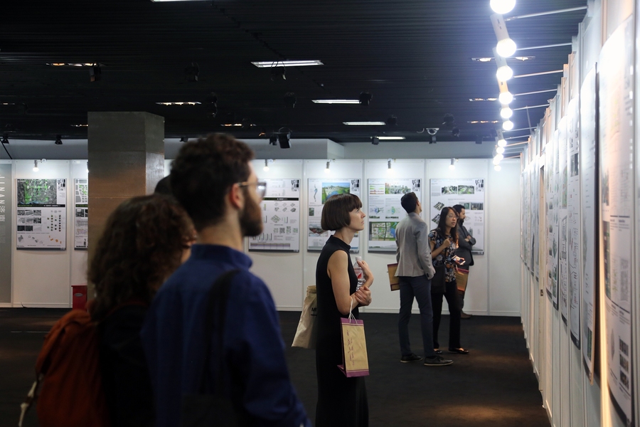 Every other summer, the Beijing Studio brings up to 20 MIT students to work with Chinese counterparts — more than 400 overall since the program’s inception. Here, MIT and Tsinghua University students view an exhibition commemorating the studio’s history. The exhibition, which opened at the Beijing Planning Exhibition Hall near Tiananmen Square on June 12, displays over 100 panels showcasing ...