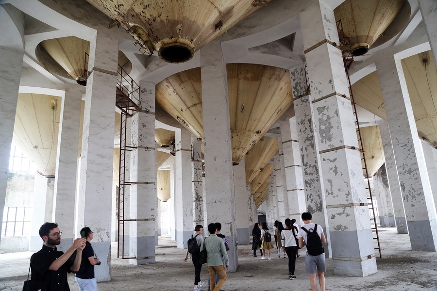 A hallmark of the Beijing Studio is asking students to tackle real-world challenges for Chinese cities. For this year’s joint urban studio, student teams were asked to develop plans to regenerate the Shanghai Minsheng Dock, an iconic 20th-century industrial district on the Huangpu River. A dramatic feature of the site is its towering rice grain elevators, which students proposed converting to us...