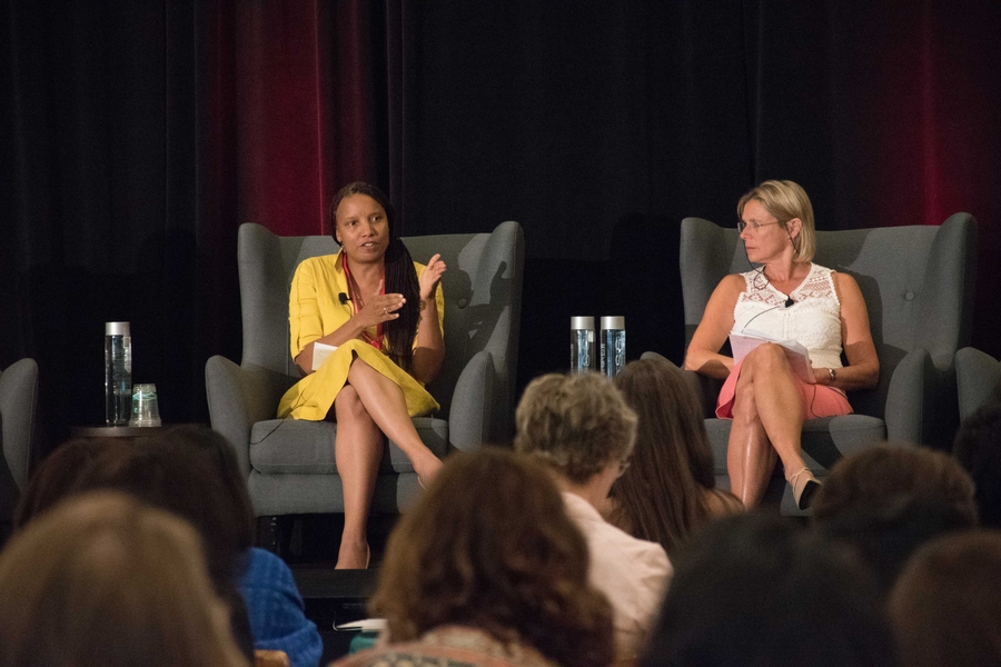 Nicole Poindexter (left), CEO of Energicity, participates in a panel about clean energy technologies in emerging markets. She is seated with fellow panelist Cathy Zoi, CEO of Axess Energy.