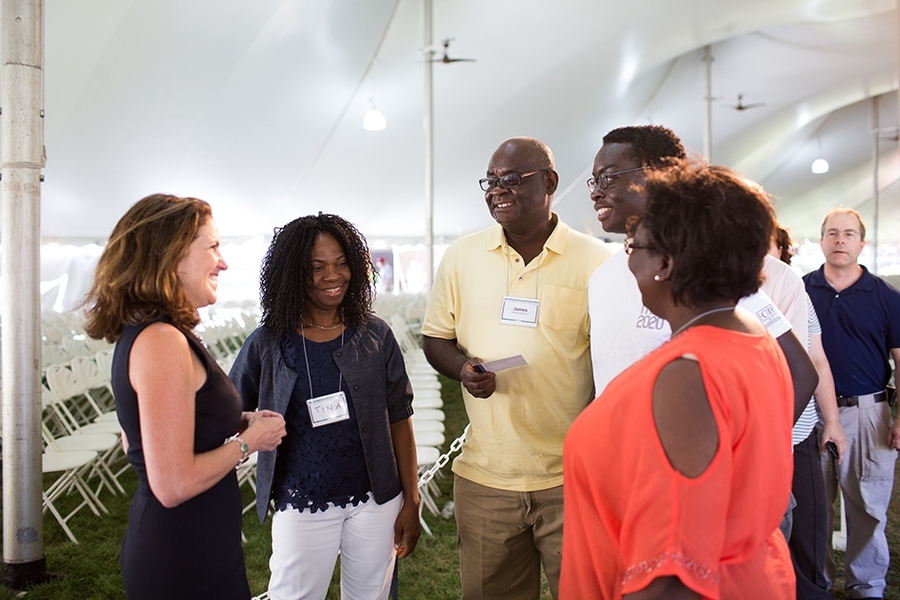 Chancellor Cynthia Barnhart (left) talked with a new student and his family.